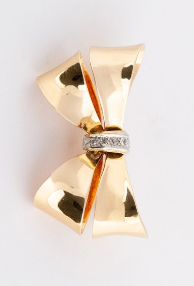 Gouden strik broche met 5 diamanten